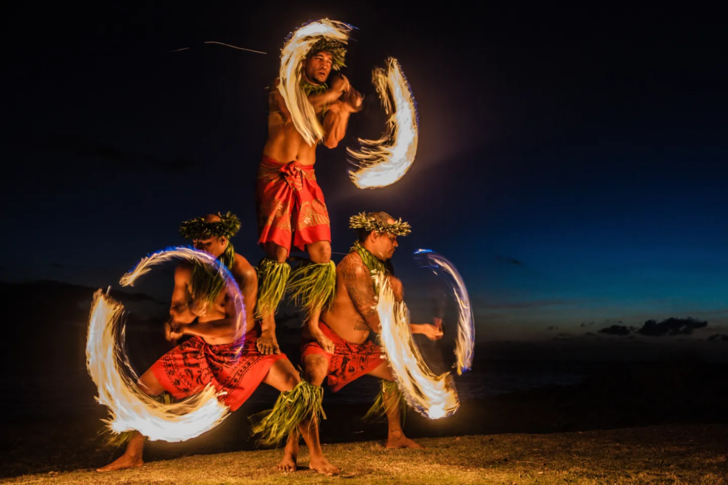Fire knife dancers performing at a Hawaiian luau