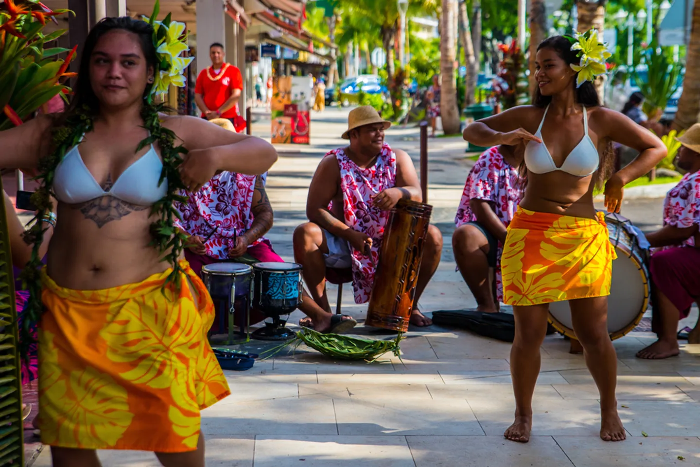 Hawaiian hula dancers and musicians performing in traditional dress