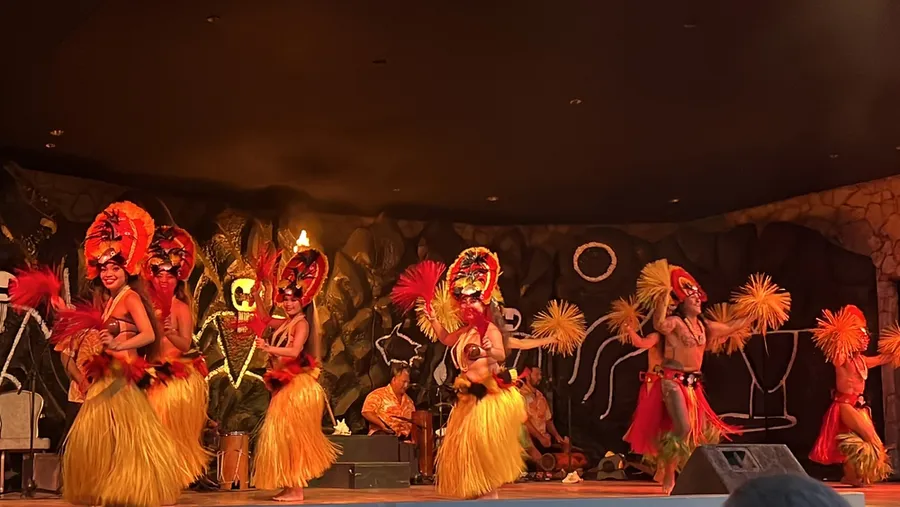 Polynesian performers in traditional costumes at a Maui luau show