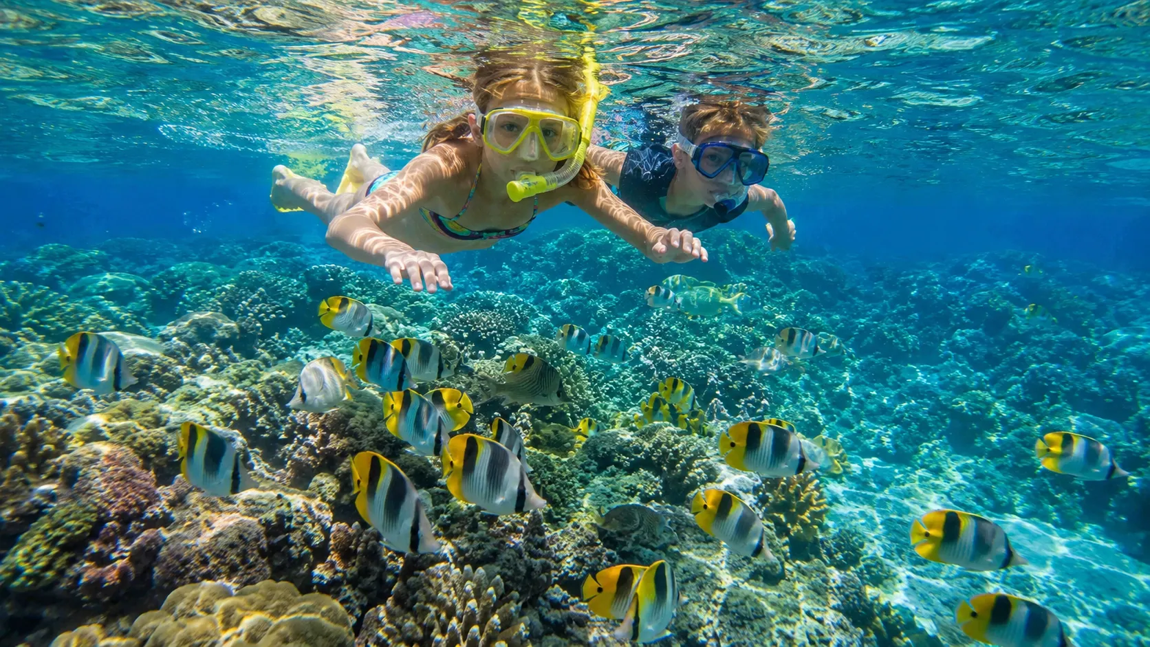 Water Activities in Kauai for Different Travel Styles - Family snorkeling in Kauai